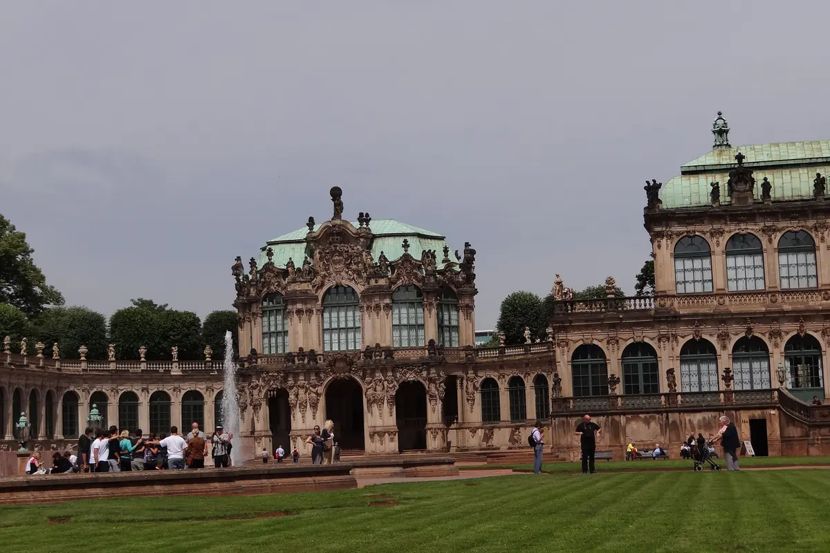 The Zwinger courtyard with a lawn in front, the Wallpavillon in the centre and the next pavilion to the right under a green roof.